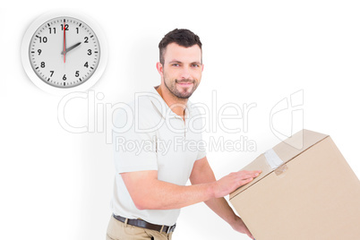 Composite image of delivery man pushing trolley of boxes