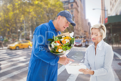 Composite image of happy flower delivery man with customer