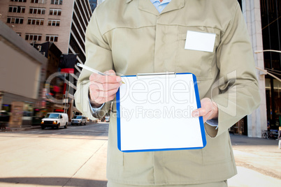 Composite image of delivery man showing blank paper on clipboard