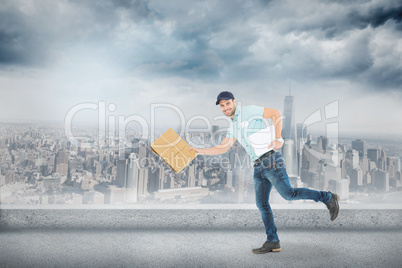 Composite image of happy delivery man running with package