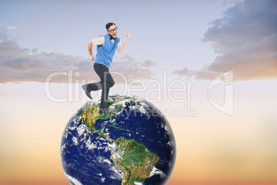 Composite image of geeky hipster dancing and smiling