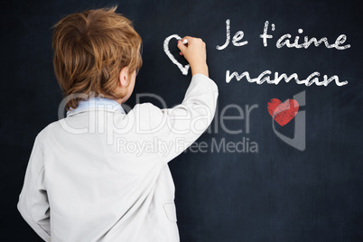 Composite image of cute pupil writing on board