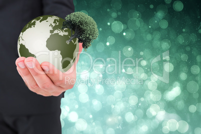 Composite image of businessman holding out his hand