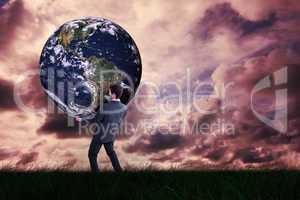 Composite image of businessman carrying the world