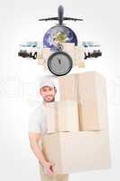 Composite image of delivery man carrying cardboard boxes