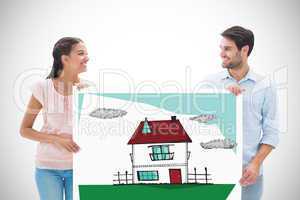 Composite image of attractive young couple smiling and holding p