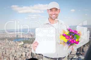 Composite image of flower delivery man showing clipboard