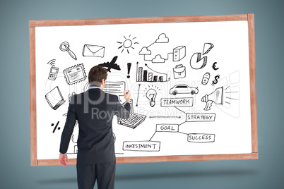 Composite image of businessman standing back to camera writing w