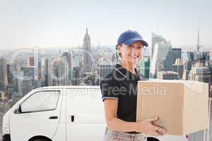 Composite image of happy delivery woman holding cardboard box