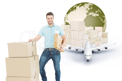 Composite image of courier man with cardboard boxes