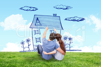 Composite image of couple sitting on floor together