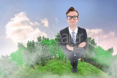 Composite image of geeky hipster smiling at camera