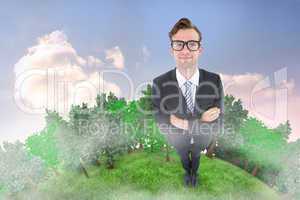 Composite image of geeky hipster smiling at camera