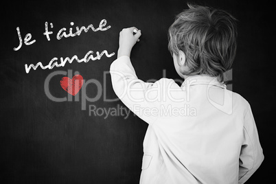 Composite image of schoolchild with blackboard