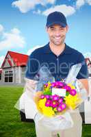 Composite image of happy delivery man holding bouquet