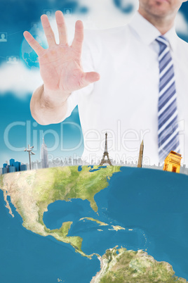 Composite image of handsome businessman gesturing with hand