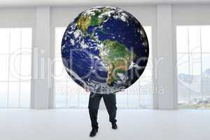 Composite image of businessman carrying the world