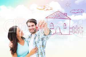 Composite image of happy young couple showing new house key