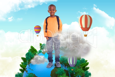 Composite image of cute elementary pupil smiling at camera