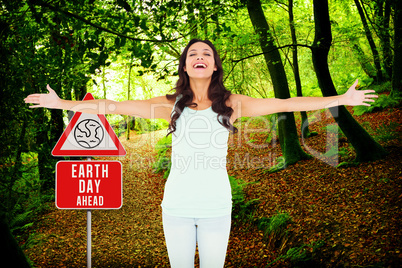 Composite image of carefree brunette with arms out