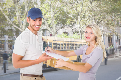 Composite image of happy delivery man giving package to customer