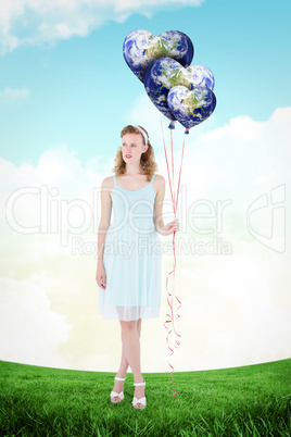 Composite image of happy hipster woman holding balloons