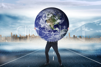 Composite image of businessman carrying the world