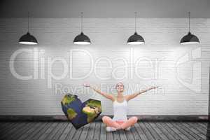 Composite image of woman sitting with arms raised