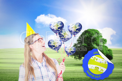 Composite image of geeky hipster holding red balloons