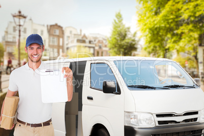 Composite image of happy delivery man holding cardboard box and