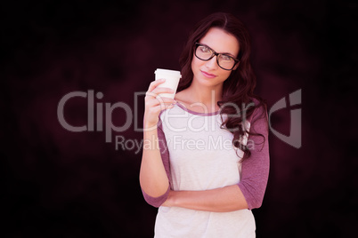 Composite image of brunette with mug