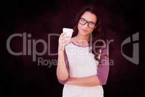 Composite image of brunette with mug