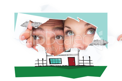 Composite image of young couple peeking through torn paper