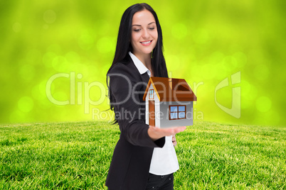 Composite image of pretty businesswoman presenting with hand