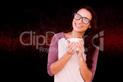 Composite image of brunette with mug
