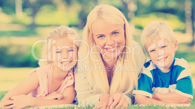 Mother with her children lying down during the summer