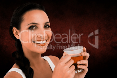 Composite image of pretty brunette having cup of tea