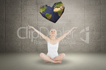 Composite image of toned young woman sitting with arms outstretc