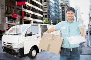 Composite image of delivery man with package giving clipboard fo