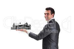 Composite image of businessman presenting with hand