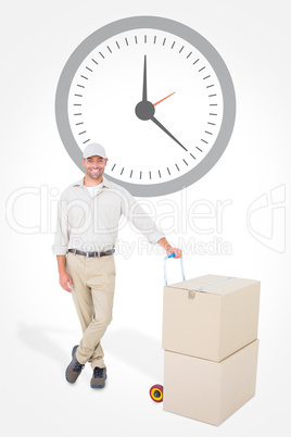 Composite image of confident delivery man with cardboard boxes