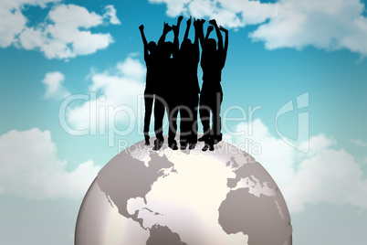 Composite image of silhouette of cheering people