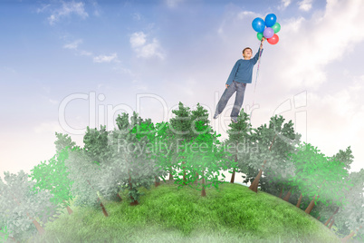 Composite image of cute boy holding balloons