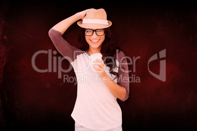 Composite image of brunette with disposable cup