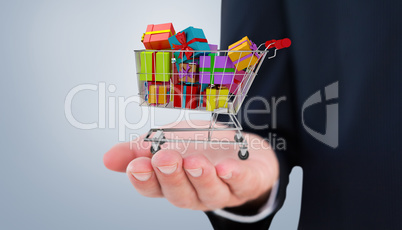 Composite image of mid section of a businessman with hands out