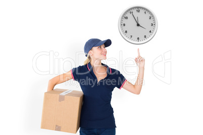 Composite image of happy delivery woman holding cardboard box an