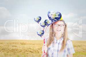 Composite image of geeky hipster smiling at camera and holding r