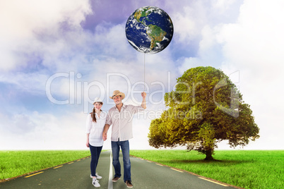 Composite image of smiling couple both wearing hats