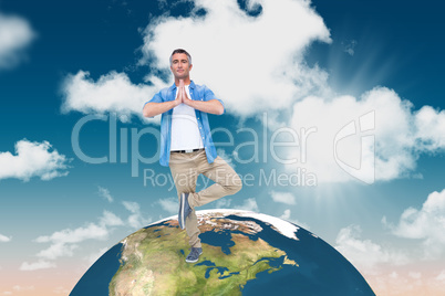 Composite image of man with grey hair in tree pose