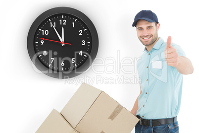 Composite image of delivery man with cardboard boxes gesturing t